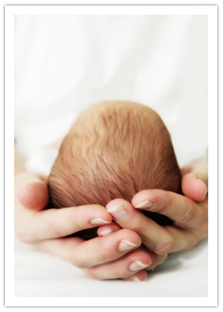 Baby held in Mother's hands